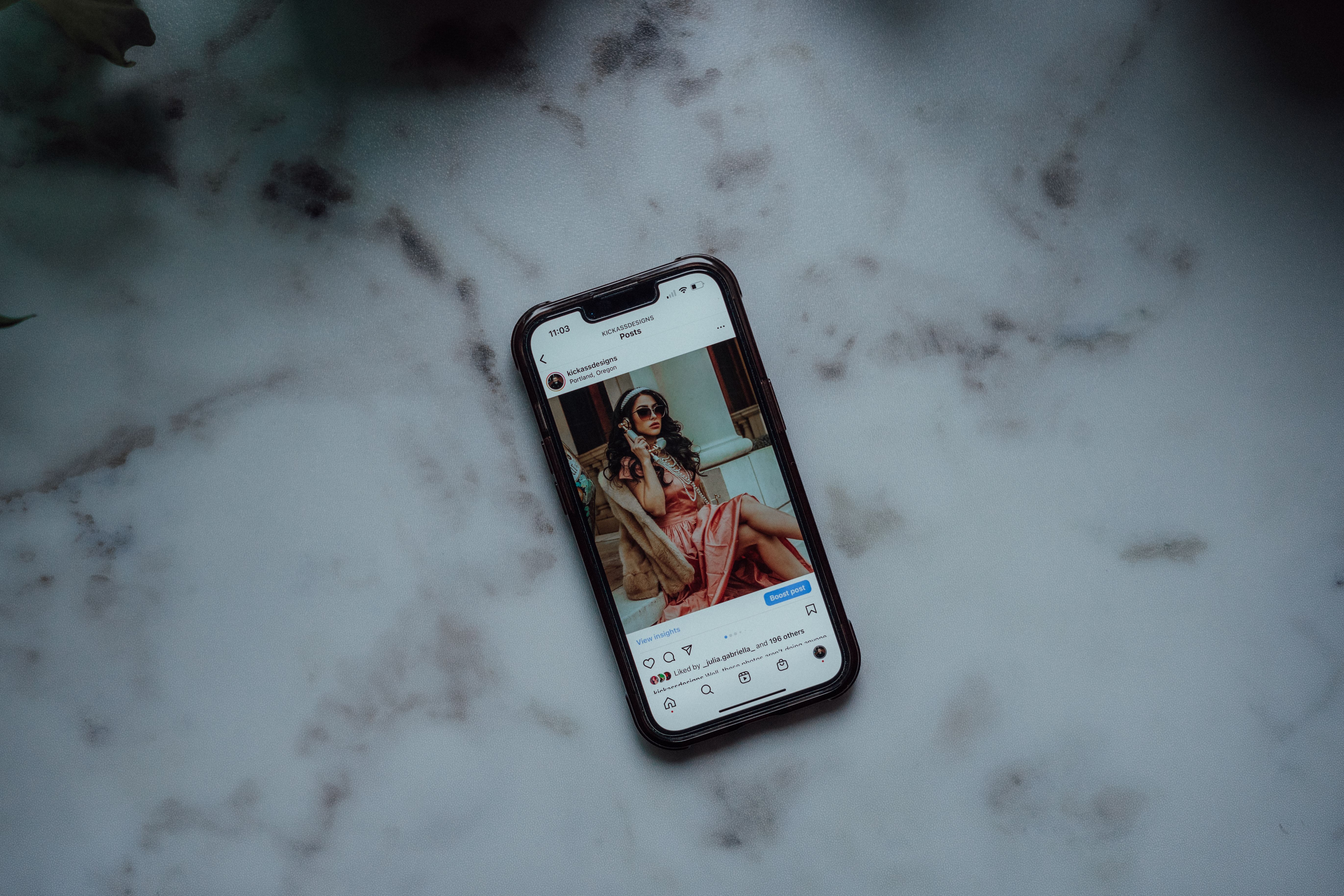Smartphone displaying an Instagram post, representing social media advertising for renovation work.